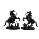 After Guillaume Coustou (1677-1746): Pair of 19th century bronzes of Marly Horses each with a groom