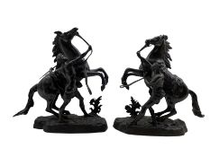 After Guillaume Coustou (1677-1746): Pair of 19th century bronzes of Marly Horses each with a groom