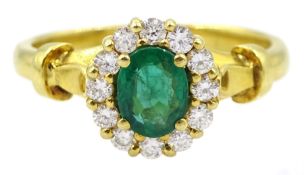 18ct gold oval emerald and round brilliant cut diamond cluster ring