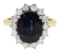 18ct gold oval sapphire and round brilliant cut diamond cluster ring