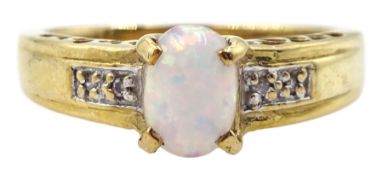 9ct gold oval opal ring with diamond set shoulders