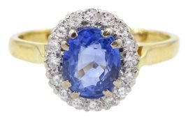 18ct gold oval light blue Ceylon sapphire and round brilliant cut diamond cluster ring