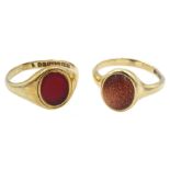 Gold single stone carnelian ring and a single stone goldstone ring