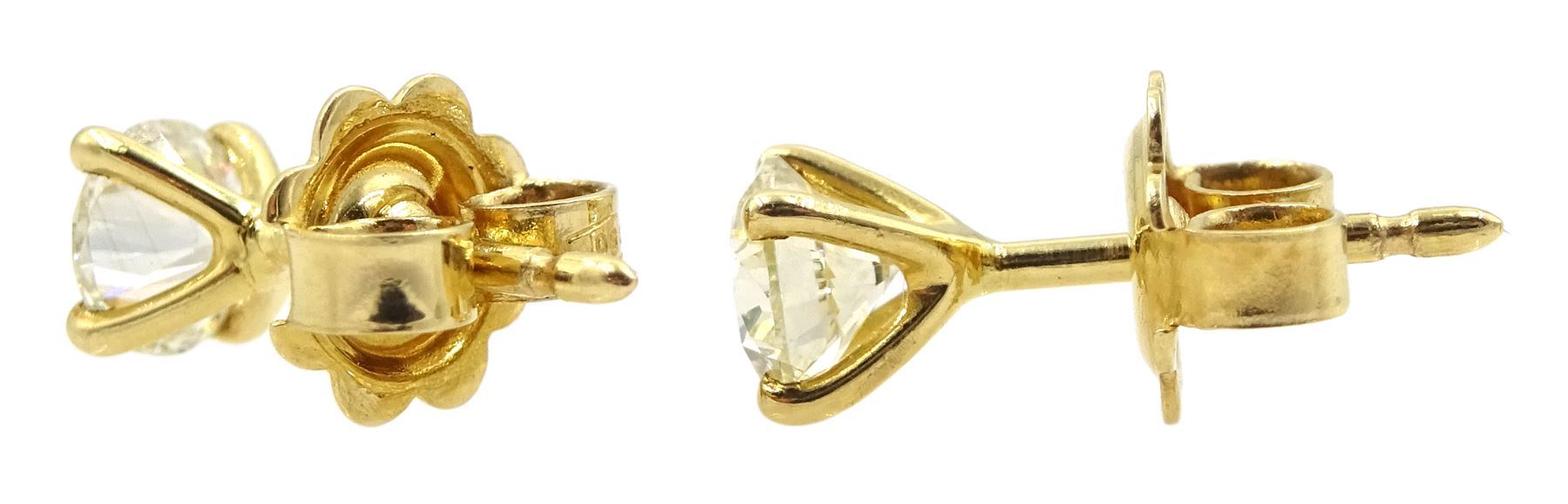 Pair of 18ct gold round brilliant cut diamond stud earrings - Image 2 of 2