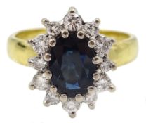 18ct gold oval sapphire and round brilliant cut diamond cluster ring