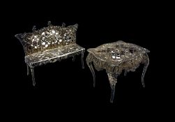 Continental silver miniature settee with pierced and embossed decoration L10cm