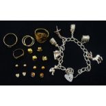 9ct gold jewellery including rings and pairs of earrings and a silver charm bracelet
