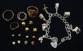 9ct gold jewellery including rings and pairs of earrings and a silver charm bracelet