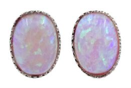 Pair of silver oval opal earrings