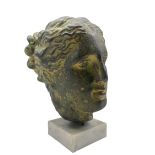 Patinated plaster bust modelled as Artemis Diana on square marble plinth