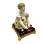 Minton porcelain figure of a girl tying her shoe lace