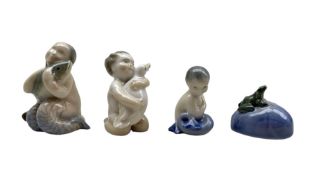Four Royal Copenhagen porcelain figures comprising a Mermaid holding a Fish no. 2348