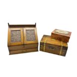 Edwardian oak correspondence box with two panelled doors carved with acanthus leaves below a raised