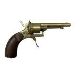 Novelty brass cigar cutter in the form of a revolver pistol with walnut grip