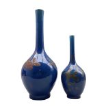 Pair of graduated Chinese blue glazed bottle vases