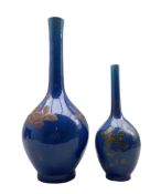 Pair of graduated Chinese blue glazed bottle vases