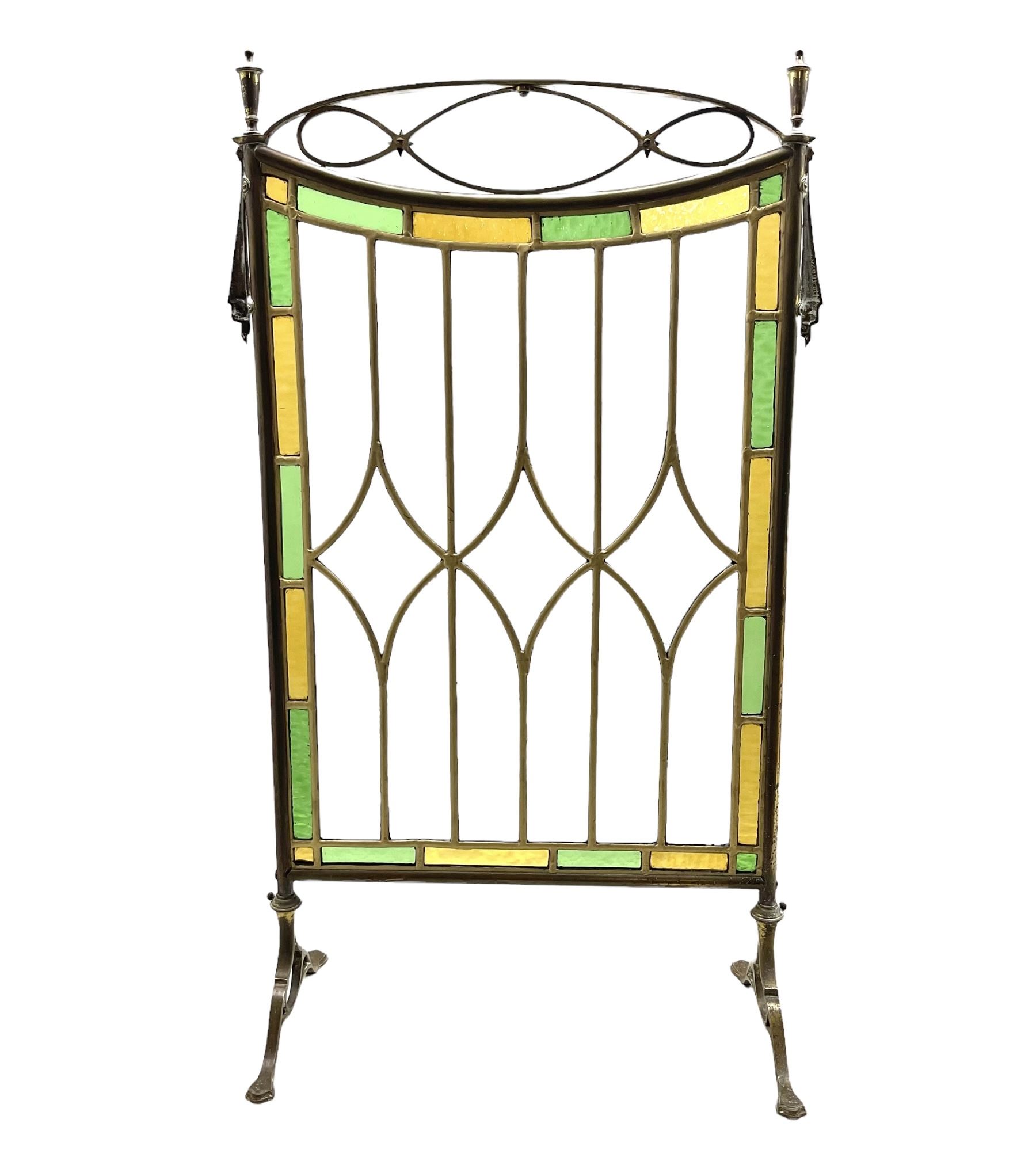 Edwardian leaded glass fire screen with brass openwork frame on splayed supports