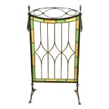 Edwardian leaded glass fire screen with brass openwork frame on splayed supports