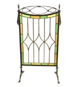 Edwardian leaded glass fire screen with brass openwork frame on splayed supports