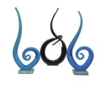 Pair of blue glass sculptures set on clear glass bases and another similar sculpture