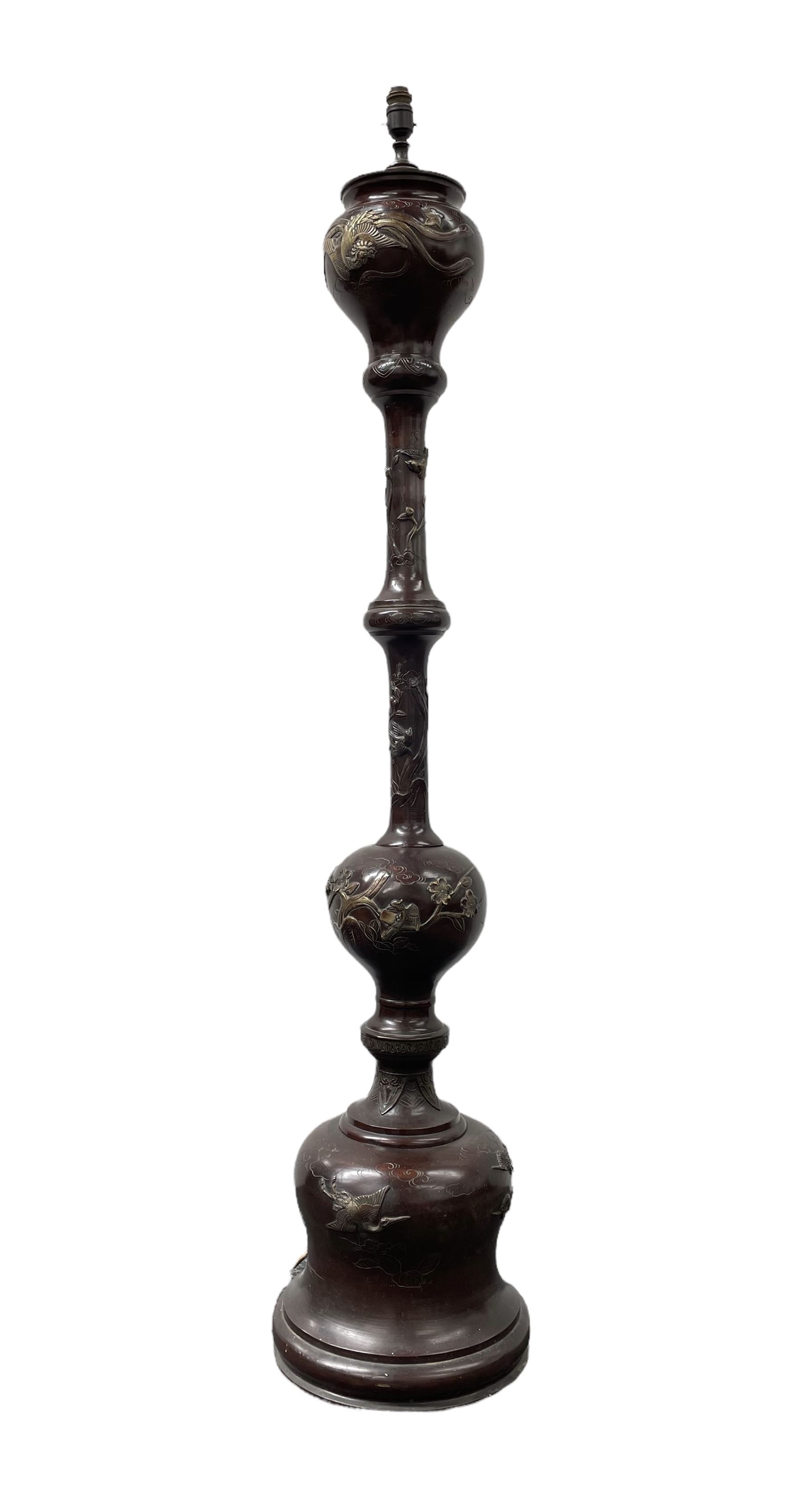 Early 20th century Japanese bronze standard lamp of baluster design decorated with a raised pattern