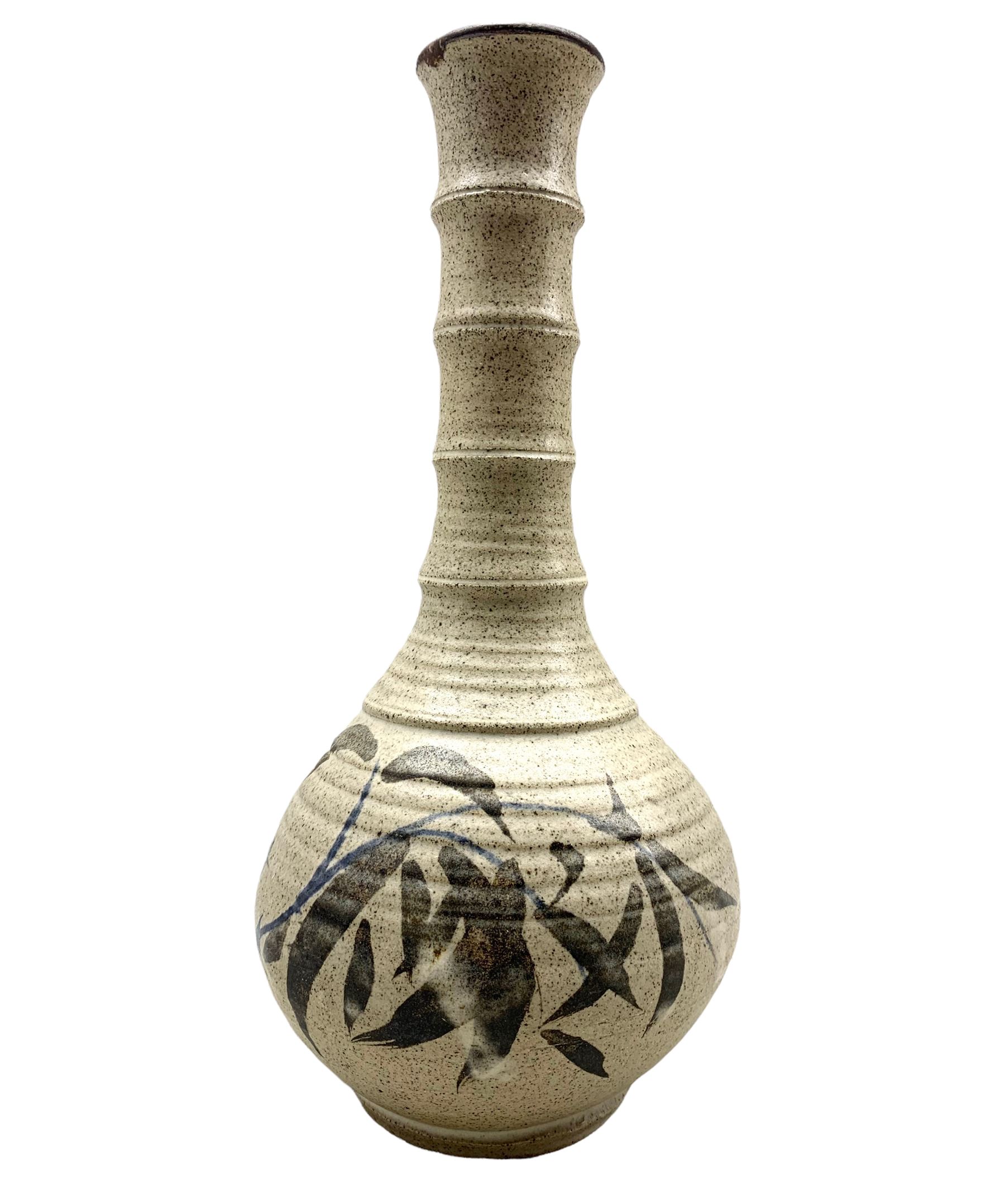 Robert Tinnyunt (Burmese 1940-): Stoneware bottle-shaped vase with bamboo effect neck