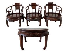 Rosewood circular table and three tub chairs