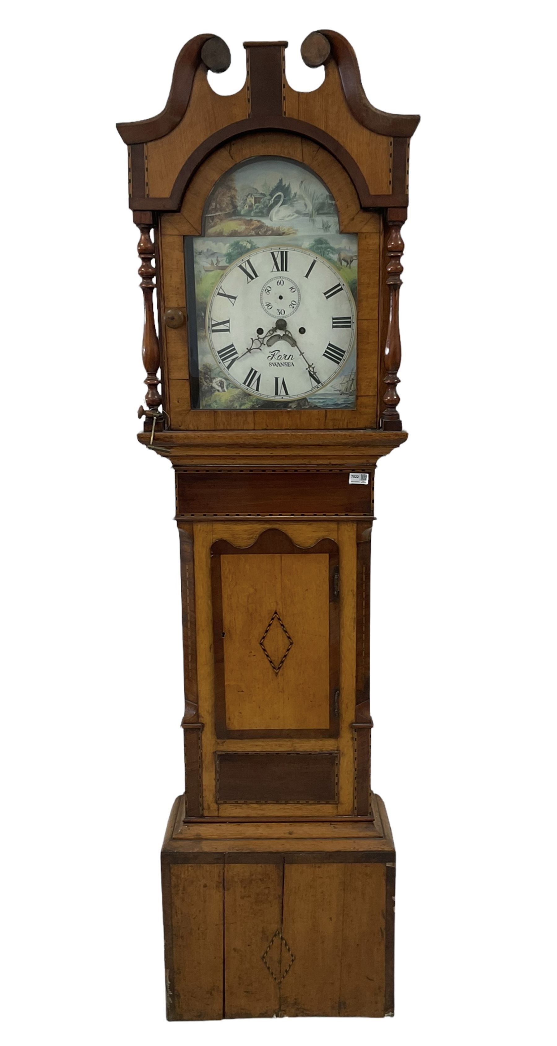 A late 19th century oak and mahogany longcase clock