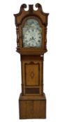 A late 19th century oak and mahogany longcase clock