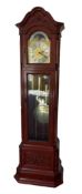 An impressive 20th century longcase clock in a mahogany case with an arched pediment