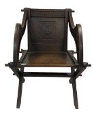 Late 19th century oak Glastonbury chair with carved inscription