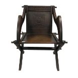 Late 19th century oak Glastonbury chair with carved inscription