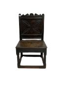 Oak panelled chair with carved back