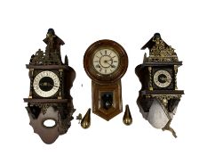 Three contemporary wall clocks