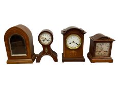 Three Edwardian mantle clocks and one Edwardian clock case