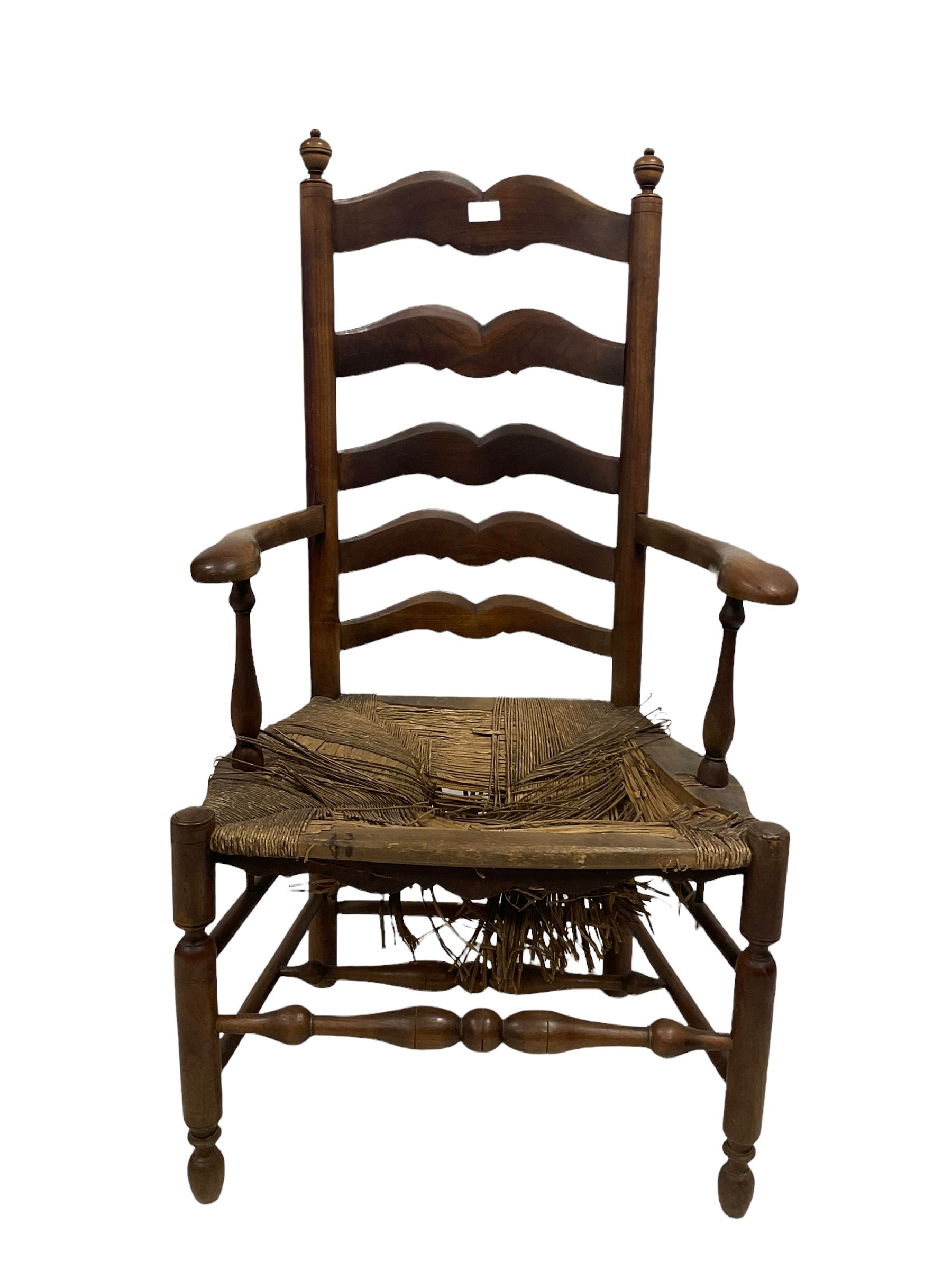 19th century fruitwood ladder back arm chair