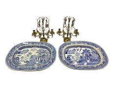 Pair of brass two branch candelabra with prism drops H30cm together with two Willow pattern meat pla