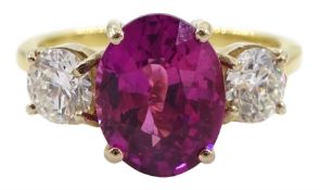 18ct gold three stone oval pink sapphire and round brilliant cut diamond ring
