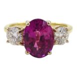 18ct gold three stone oval pink sapphire and round brilliant cut diamond ring