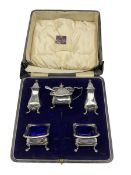 Silver condiment set comprising pair of salts with blue glass liners