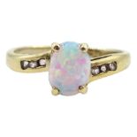 9ct gold single stone oval opal ring with cubic zirconia set shoulders