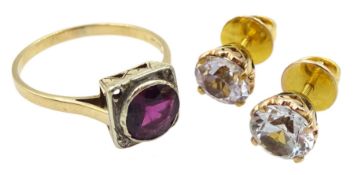 Pair of gold clear stone set stud earrings and a gold purple stone and diamond ring