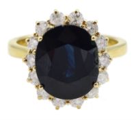 18ct gold oval sapphire and round brilliant cut diamond cluster ring