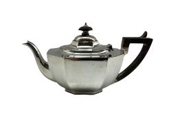 Silver teapot of panel sided design with ebonised handle and lift London 1921 Maker Charles Alfred A