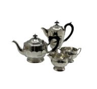 Silver three piece tea set of panel sided circular form