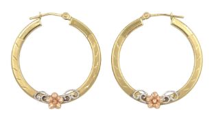 Pair of 9ct gold hoop earrings with applied white and rose gold floral decoration