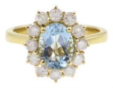 18ct gold oval aquamarine and round brilliant cut diamond cluster ring