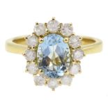 18ct gold oval aquamarine and round brilliant cut diamond cluster ring