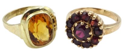 Gold single stone citrine ring and a gold garnet cluster ring