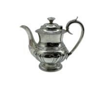 George IV silver coffee pot of baluster design with leaf capped handle